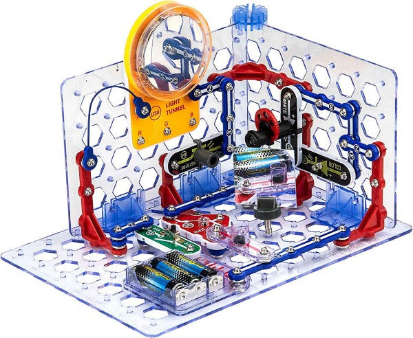 Colorful snap-together electronic circuit modules and wires assembled on a 3D clear plastic grid base.
