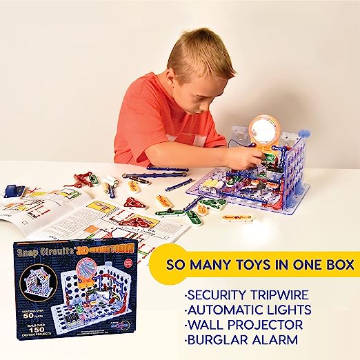 Child building 3D electronic projects with colorful snap pieces, instruction manual, and box on a white table.