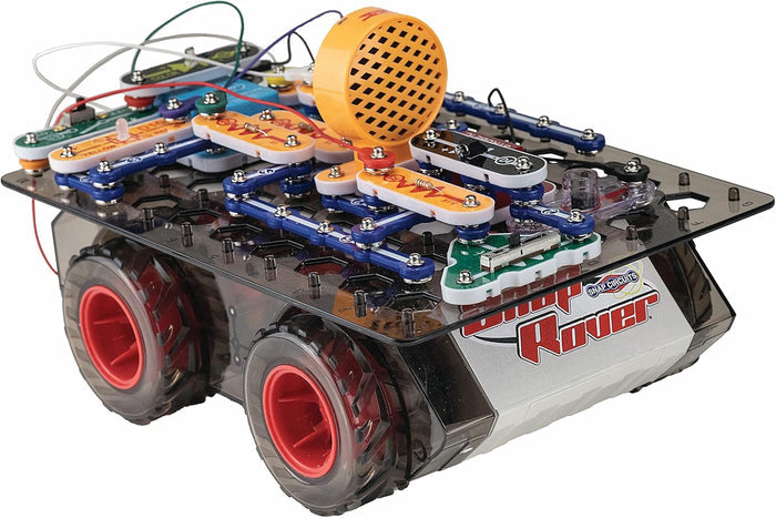 Toy rover with large red wheels and colorful modular snap-on circuit components arranged on a transparent base.