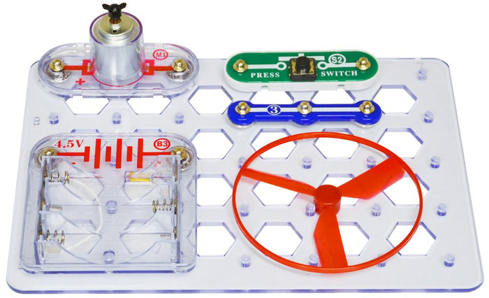 Clear plastic circuit board with a red fan, green press switch, silver motor, and 4.5V battery pack.