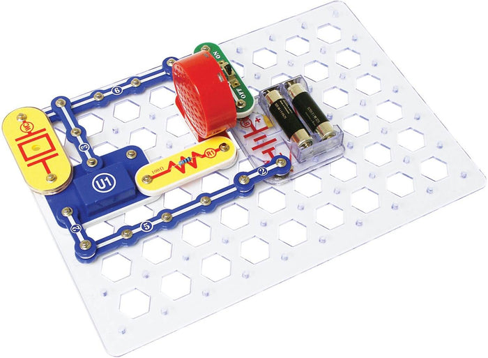 Assembled circuit featuring a red speaker, battery pack, and blue connectors on a clear hexagonal grid base.