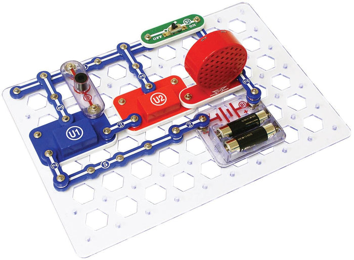 Colorful circuit modules, red speaker, and battery pack snapped onto a clear hexagonal plastic grid base.