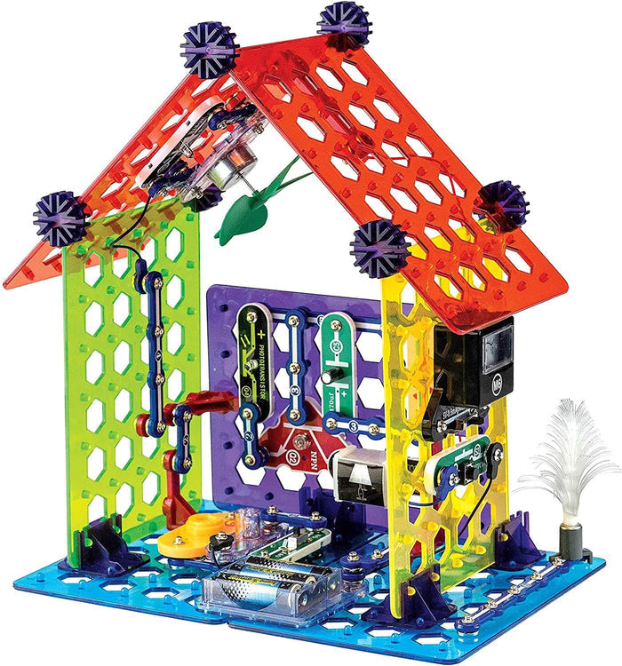 Toy house with red grid roof, colorful walls, and internal electronic circuit components on a blue base.