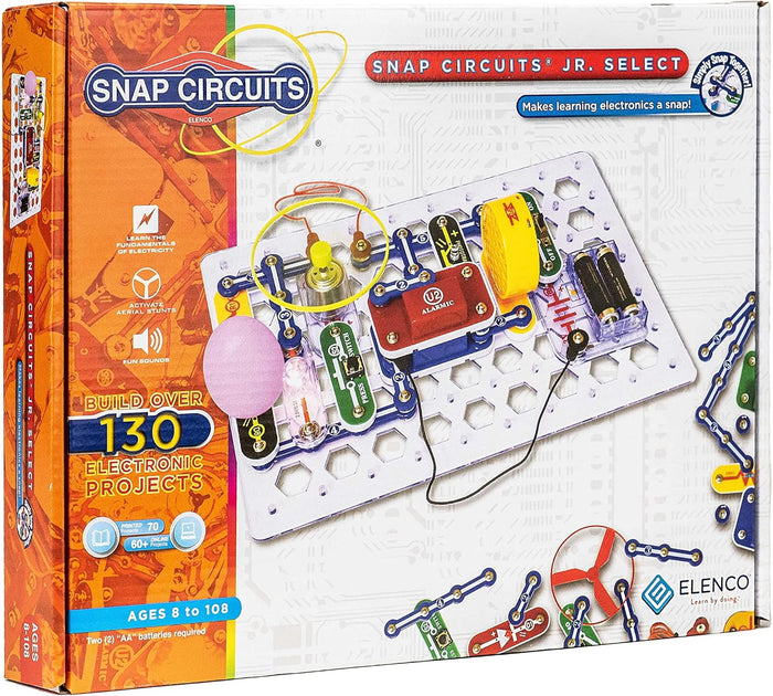 Orange Snap Circuits box showing colorful electronic modules snapped onto a white plastic grid for building 130 projects.
