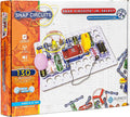 Orange Snap Circuits box showing colorful electronic modules snapped onto a white plastic grid for building 130 projects.