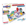 Snap Circuits Pro box showing a complex circuit with colorful red, green, and blue parts on a white grid.