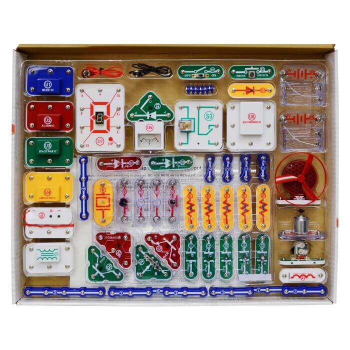 Colorful electronic snap-together parts including blue wires, various switches, and a red fan in a clear storage tray.