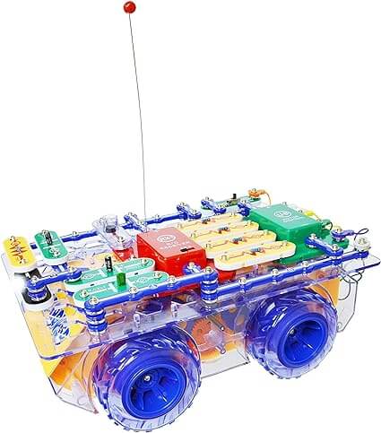 Toy robot rover with clear body, blue wheels, multi-colored snap circuits, and a long antenna with a red tip.