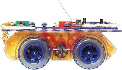 Side view of a toy rover with clear orange body, red gears, large blue wheels, and circuit components on top.