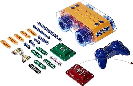 Yellow RC rover with blue wheels, remote control, and various colorful snap-on electronic circuit components.