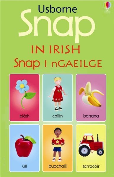 Green Usborne game box with six colorful cards: flower, girl, banana, apple, boy, and tractor with Irish labels.