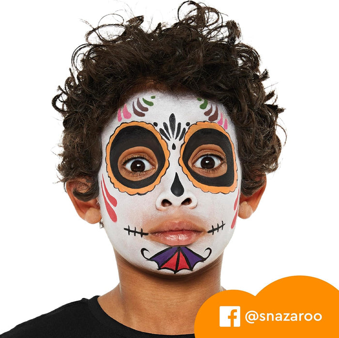 Child with colorful sugar skull face paint featuring a white base, black eye circles, and orange accents.