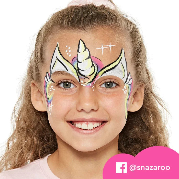 Young girl with colorful unicorn face paint featuring a yellow horn, white ears, and rainbow accents.