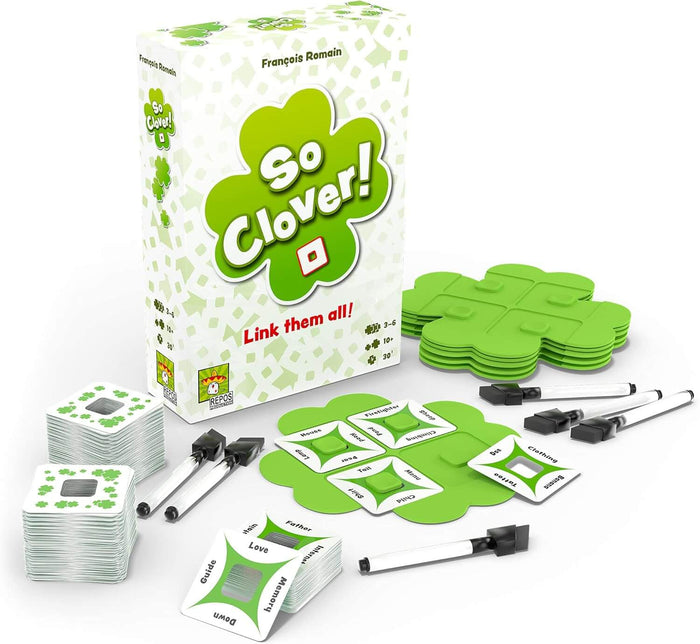 White game box with green clovers, clover-shaped boards, square word cards with center cutouts, and markers.