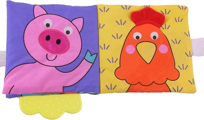 Soft cloth book featuring a pink pig and orange chicken with a yellow scalloped teething toy attached at the bottom.