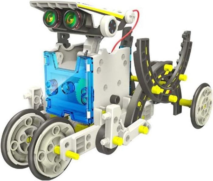 White and grey toy robot with green lens eyes, a transparent blue center, and yellow connector pins on four wheels.