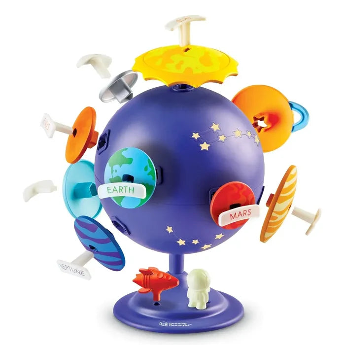 Purple toy globe featuring star constellations and removable planet pieces like Earth and Mars, on a base with a rocket.