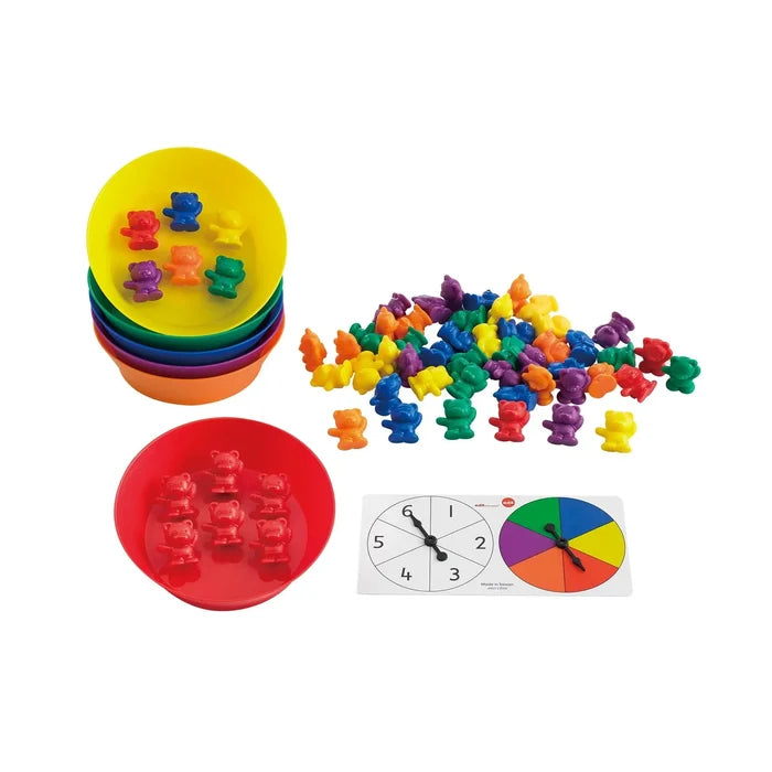 Colorful plastic bear figurines with matching bowls and a double spinner featuring numbers and colors.