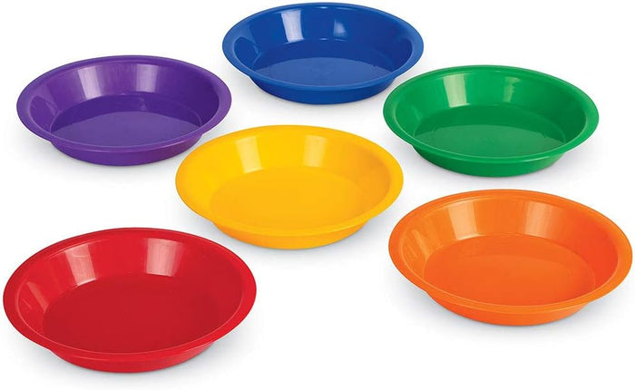 Six shallow, circular plastic bowls in vibrant colors: purple, blue, green, yellow, orange, and red.