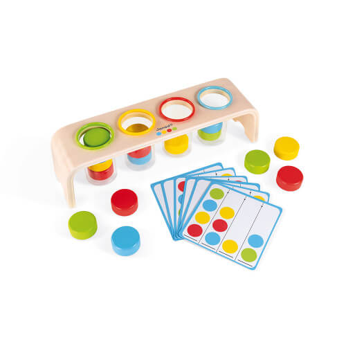 Wooden sorting toy with four colored holes, clear tubes, matching colored wooden discs, and pattern cards.