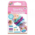 Pink Galt Sparkly Scrunchies box showing five colorful, sequined hair ties on an arm and the DIY kit materials below.