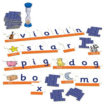 Orchard Toys spelling game with illustrated word puzzle strips, letter tiles, and a blue sand timer.