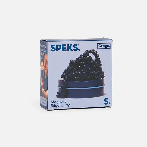 Speks Crags square white box featuring dark navy blue magnetic stones piled on a matching round indigo tin.