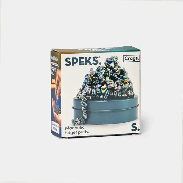 Speks Crags box featuring shiny, iridescent magnetic pebbles piled on a dark teal metal tin.