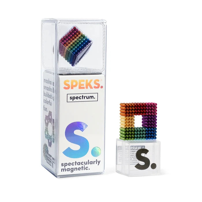 Tiny rainbow magnetic spheres in a cube and square frame next to clear and white display packaging.