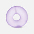 Translucent purple donut-shaped gel loop with a smooth, squishy texture against a light gray background.