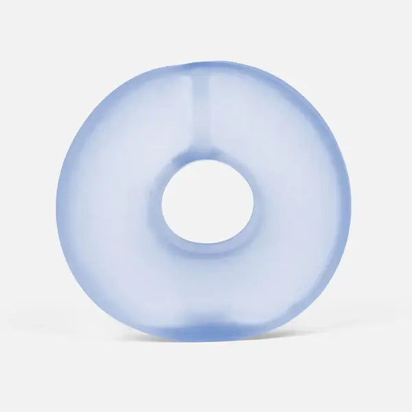 Translucent light blue doughnut-shaped gel ring with smooth, thick edges against a white background.