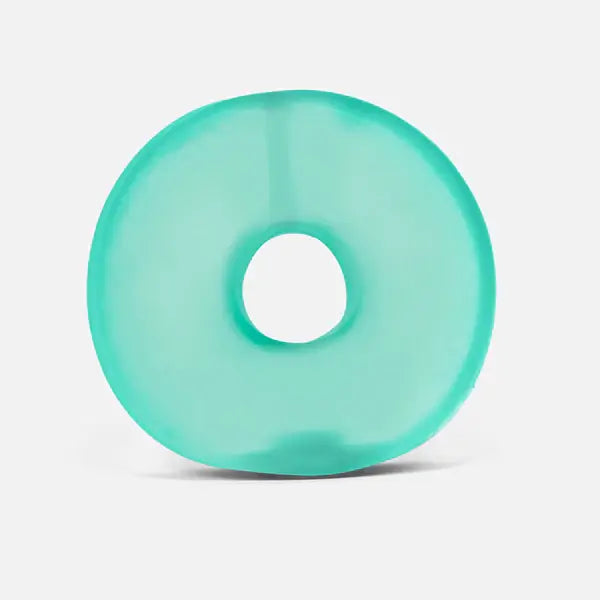 A translucent teal green memory gel ring with a smooth, rounded donut shape on a white background.