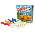 Four colorful plastic alligators and white letter tiles next to the illustrated Spelligator board game box.
