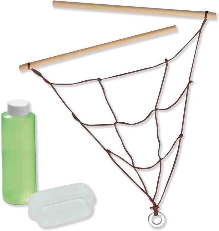 Two wooden sticks with a red spiderweb rope net, a green bubble solution bottle, and a clear plastic dipping tray.