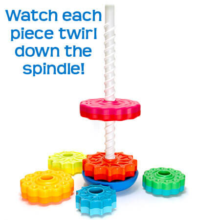Vibrant gear-shaped discs in rainbow colors spinning down a white spiral spindle on a blue base.