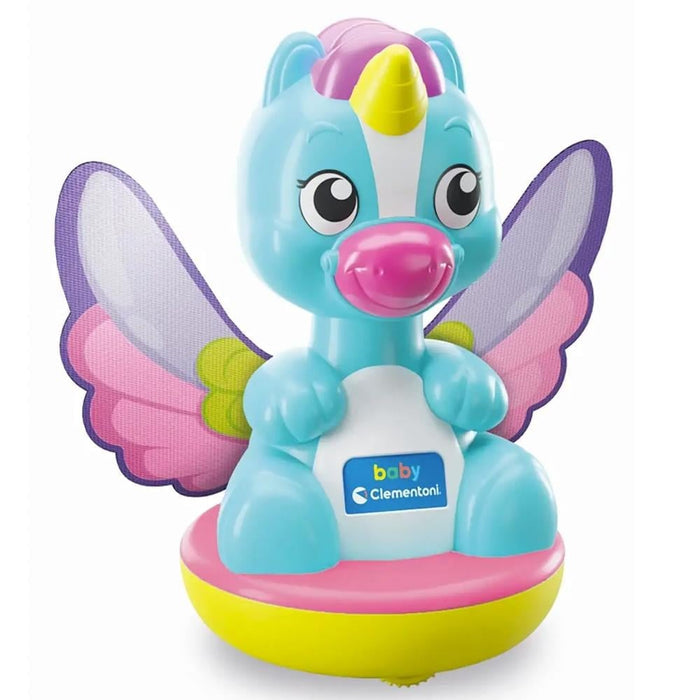 Blue toy baby unicorn with purple wings and a yellow horn sitting on a rounded yellow and pink base.