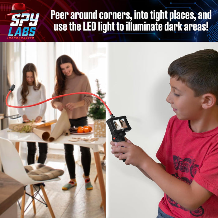 Boy using a handheld digital scope with a flexible red cable to see two people around a corner on a small color screen.