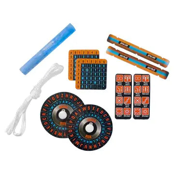 Spy gear featuring orange and black cipher disks, grid cards, orange sticks, a blue tube, and a white cord.