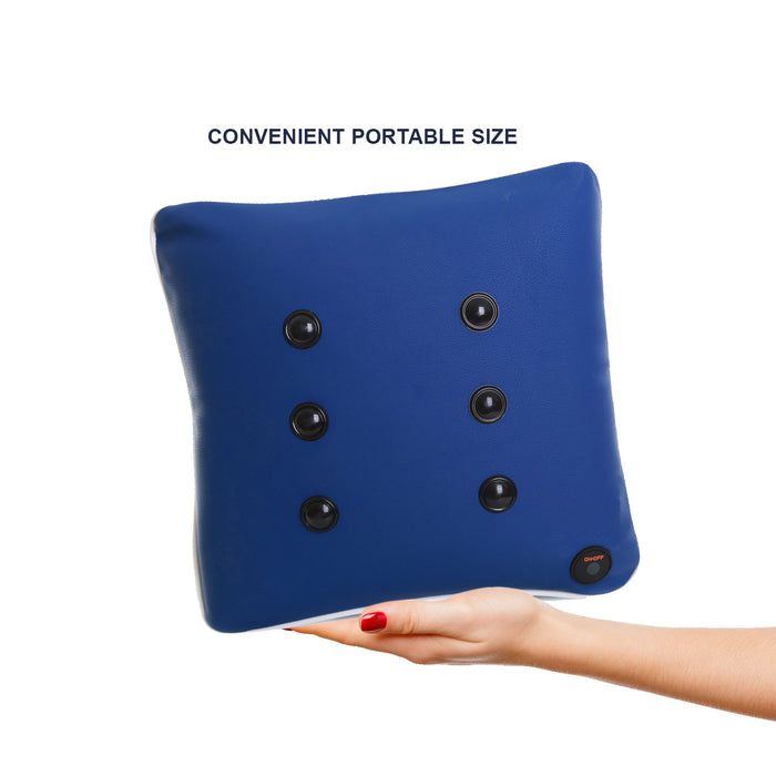 Blue square massage cushion with six black nodes and an on/off button, held in a hand to show its portable size.