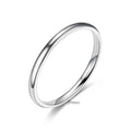 Stainless steel 2mm wide glossy mirror polished plain band ring by Glitters, showcasing its smooth, reflective surface and simple design.