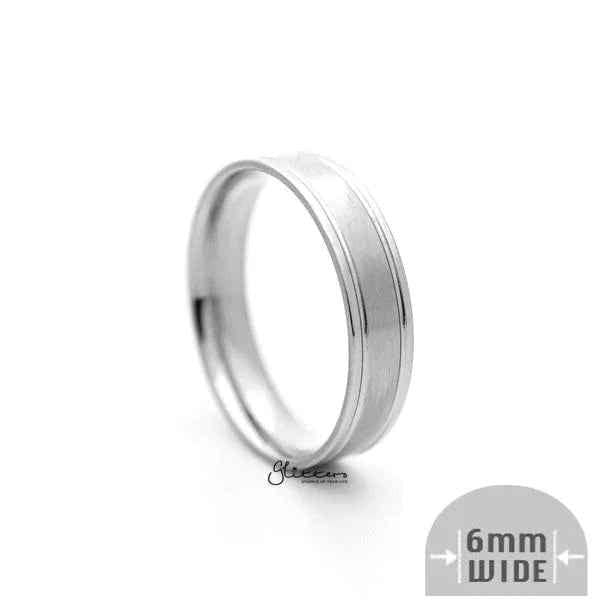 Silver stainless steel ring with a 6mm wide brushed center band, stylish and durable jewelry from Glitters.