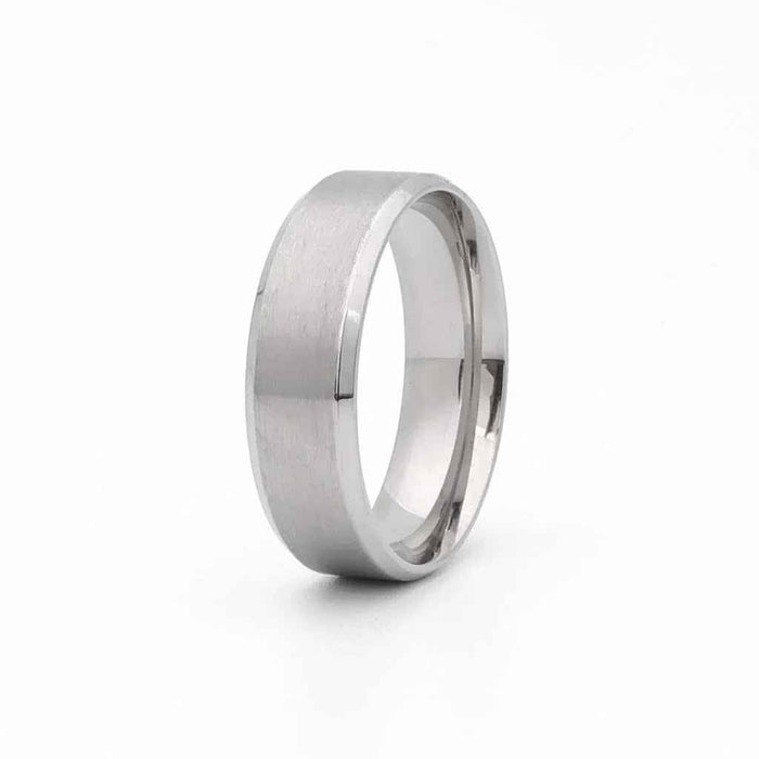 Stainless steel 8mm wide beveled edge band ring by Glitters, showcasing a sleek, polished design on a plain background.