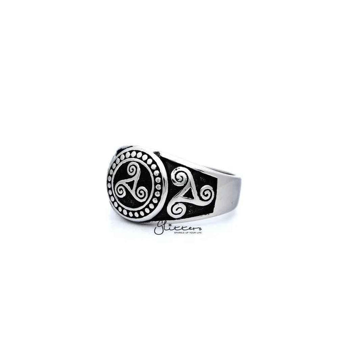 Stainless steel men's ring with antiqued triskele and triple spiral design, cast by Glitters.