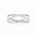 Silver stainless steel criss cross X ring by Glitters, showcasing a sleek, modern design with polished finish.