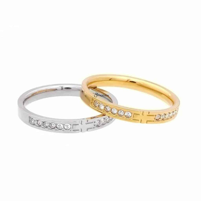 Silver stainless steel cross ring with sparkling cubic zirconia stones from Glitters, detailed close-up of the jewelry design.