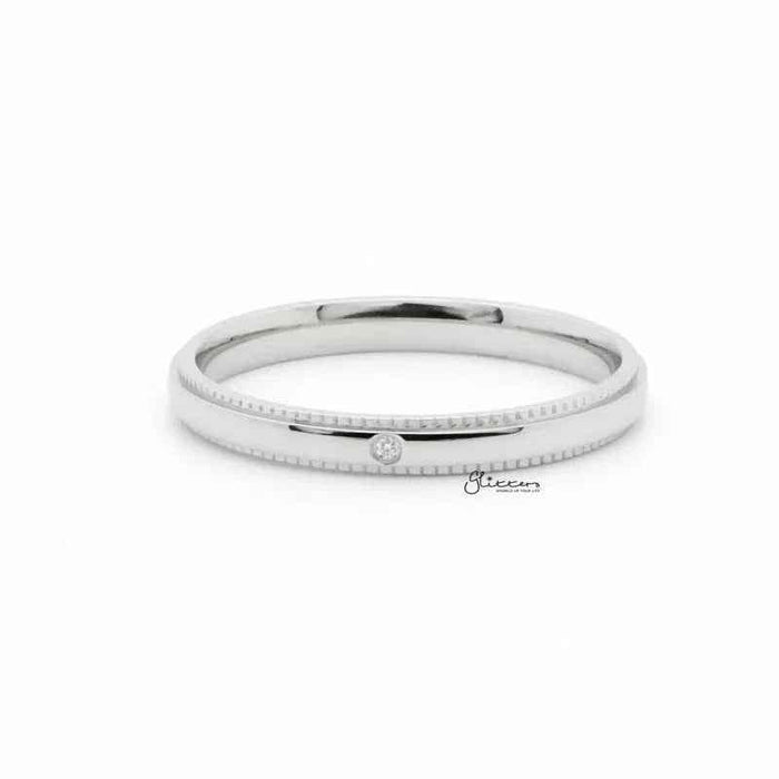 Silver stainless steel ring with CZ inlay, showcasing a sleek band design from Glitters, suitable for stylish everyday wear.
