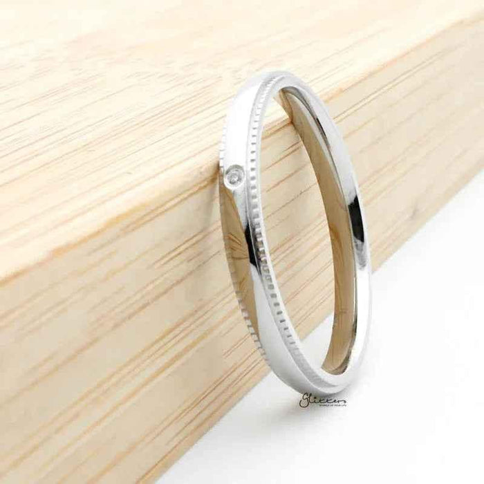 Silver stainless steel ring with CZ inlay, featuring a sleek band design from Glitters.
