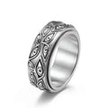 Silver stainless steel Eye Of God spinner ring by Glitters, featuring intricate design and smooth spinning band.