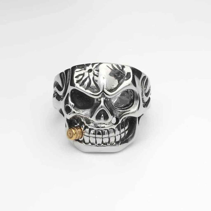 Stainless steel skull ring with gold bullet detail from Glitters, showcasing a detailed skull design and metallic finish.