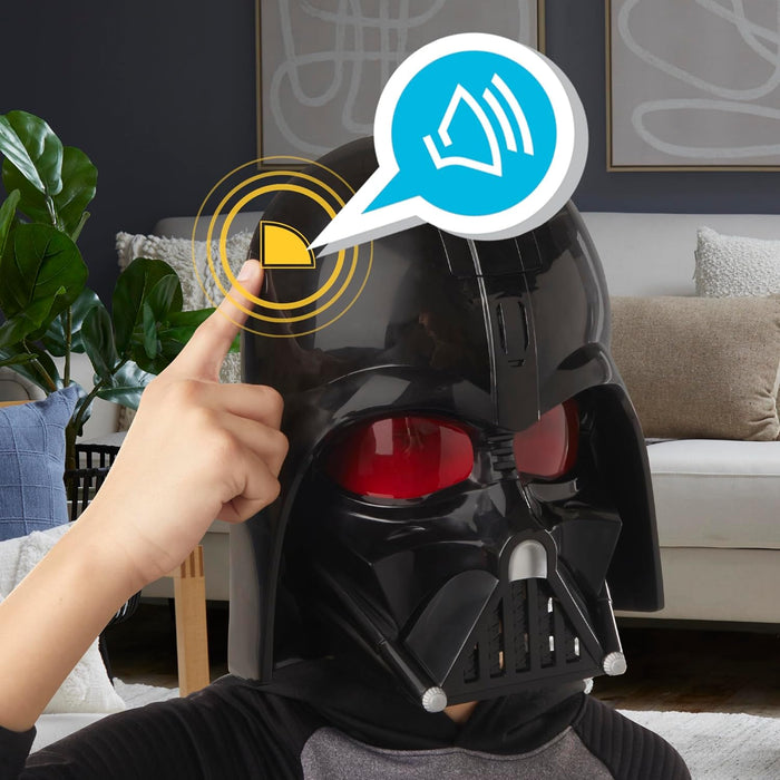 Child wearing a black Darth Vader mask with red lenses, pressing a side button to activate sound effects.